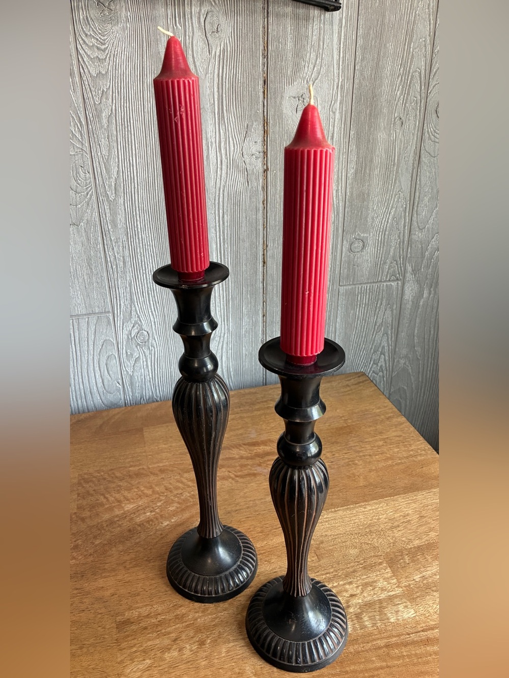 Vintage like Black Metal Candlesticks with Red Ribbed Taper Candles. Very heavy